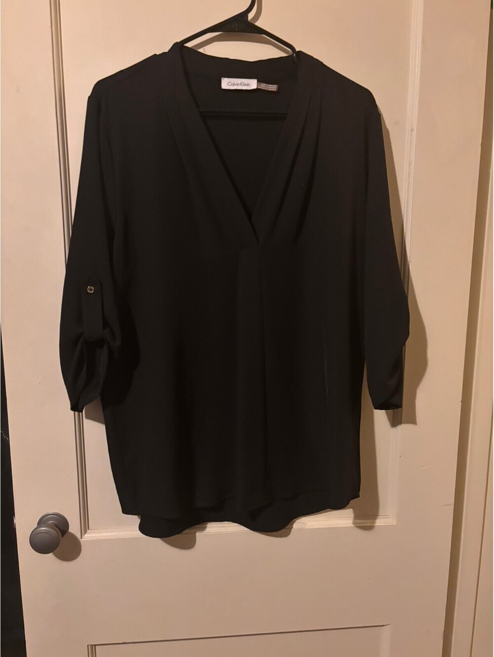 Calvin Klein black V-neck blouse